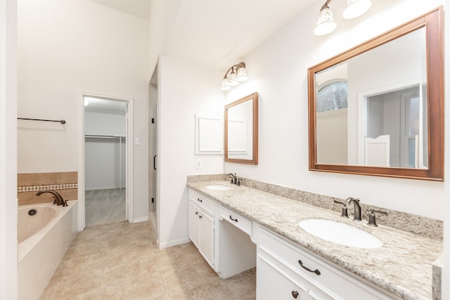 bathroom featuring a tub to relax in and vanity