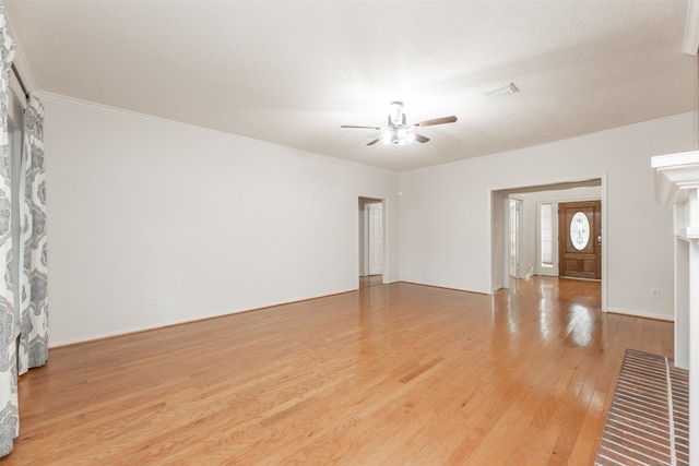 unfurnished living room with ceiling fan, a textured ceiling, ornamental molding, and light hardwood / wood-style flooring