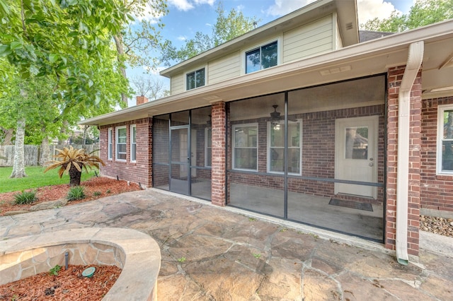 view of patio with a sunroom