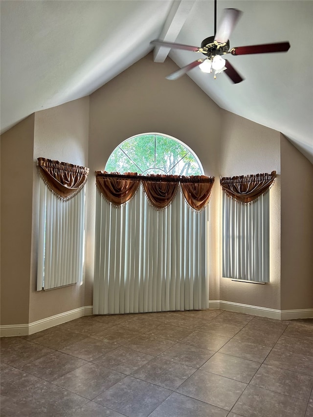 interior space with vaulted ceiling with beams and ceiling fan