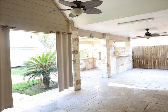 view of patio with ceiling fan and exterior kitchen