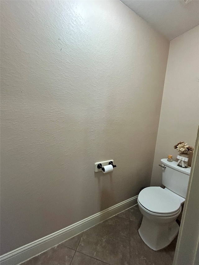 bathroom featuring tile patterned floors and toilet