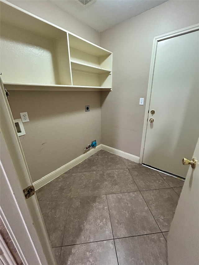 laundry area with tile patterned floors, gas dryer hookup, and hookup for an electric dryer