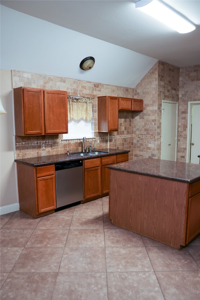 kitchen with sink, vaulted ceiling, stainless steel dishwasher, tasteful backsplash, and light tile patterned flooring