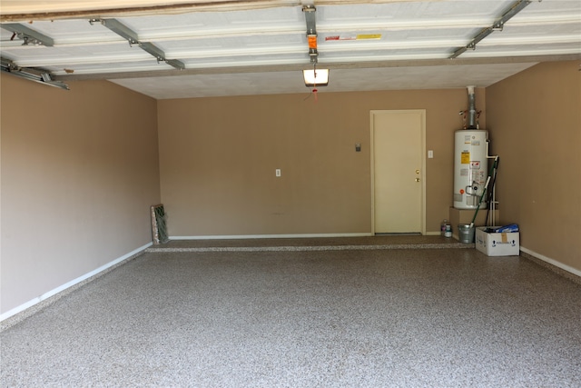 garage featuring gas water heater and a garage door opener