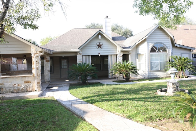 view of front of property with a porch and a front yard