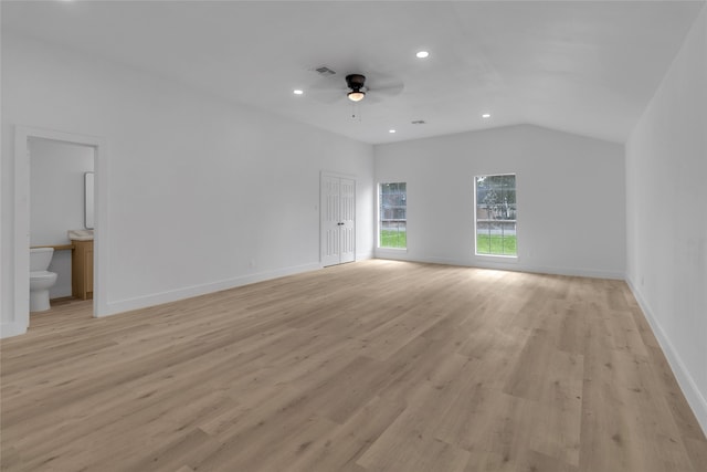 interior space featuring ceiling fan, light wood-type flooring, and lofted ceiling