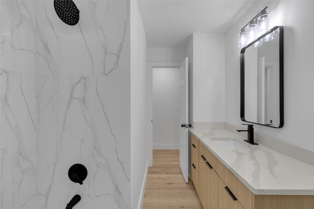 bathroom featuring vanity and hardwood / wood-style flooring