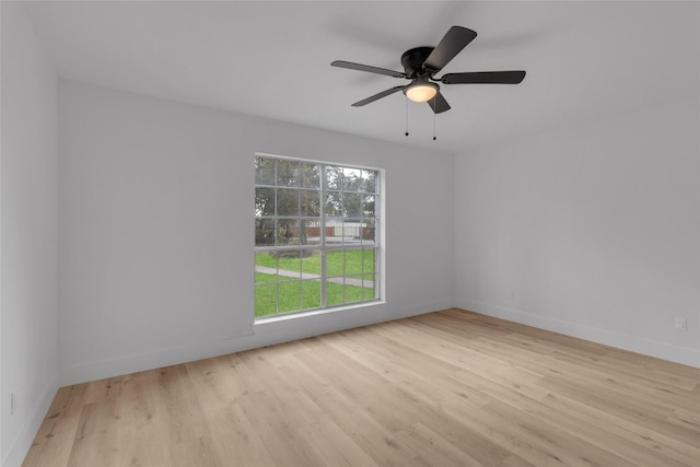 spare room featuring ceiling fan and light hardwood / wood-style flooring