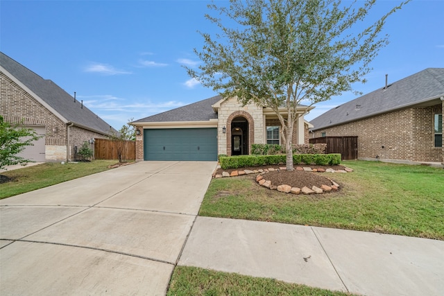 view of front of property featuring a garage and a front yard