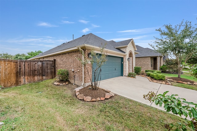 view of side of home featuring a garage and a yard