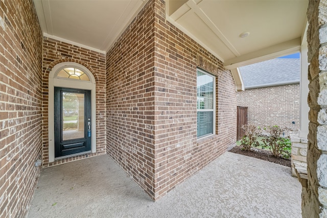 entrance to property featuring a patio area