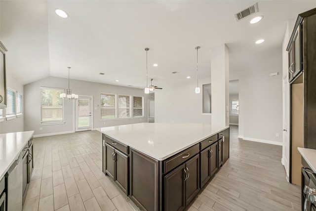 kitchen with ceiling fan with notable chandelier, vaulted ceiling, dark brown cabinets, light wood-type flooring, and decorative light fixtures