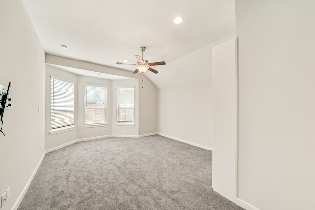 additional living space featuring carpet, lofted ceiling, and ceiling fan