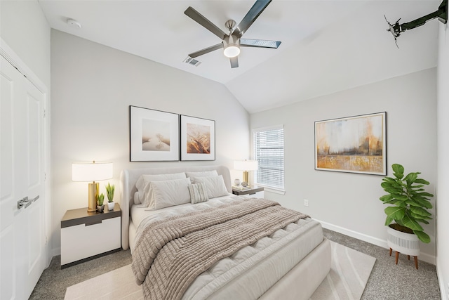 bedroom with a closet, lofted ceiling, light carpet, and ceiling fan