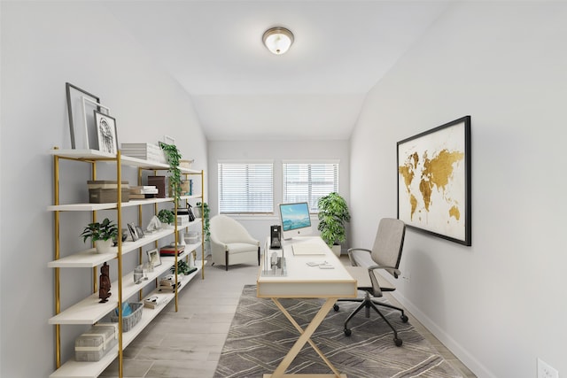 office space with lofted ceiling and wood-type flooring