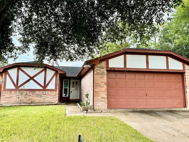 view of front of house with a garage and a front yard