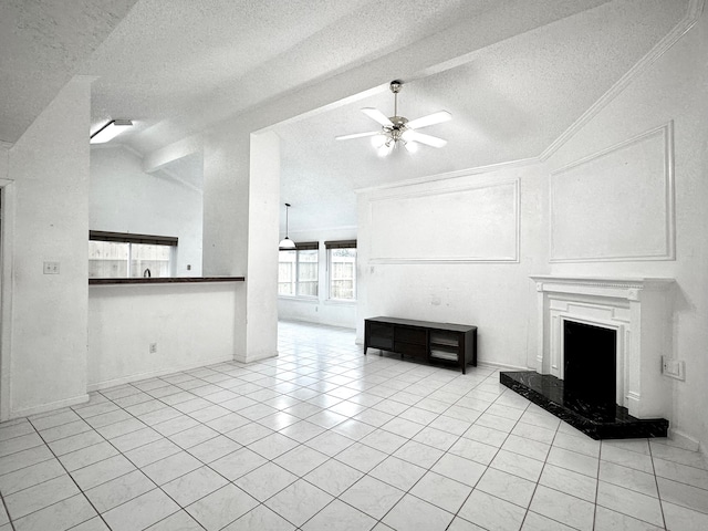 unfurnished living room with a textured ceiling, light tile patterned floors, lofted ceiling, a high end fireplace, and ceiling fan