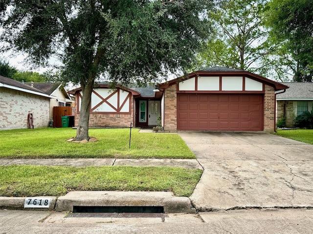 view of front of home with a garage and a front yard