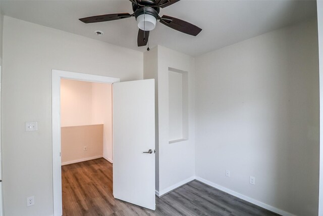 4508 Clover St, Houston, TX 77051 - unfurnished bedroom with dark wood finished floors, baseboards, and a ceiling fan
