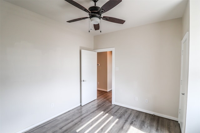 unfurnished bedroom featuring ceiling fan and light wood-type flooring