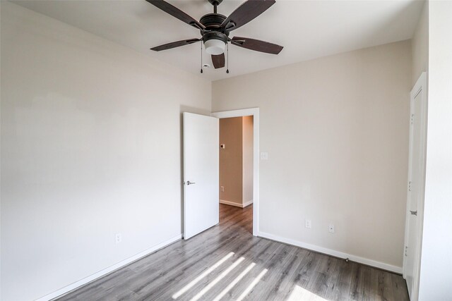 4508 Clover St, Houston, TX 77051 - unfurnished bedroom featuring wood finished floors, baseboards, and a ceiling fan