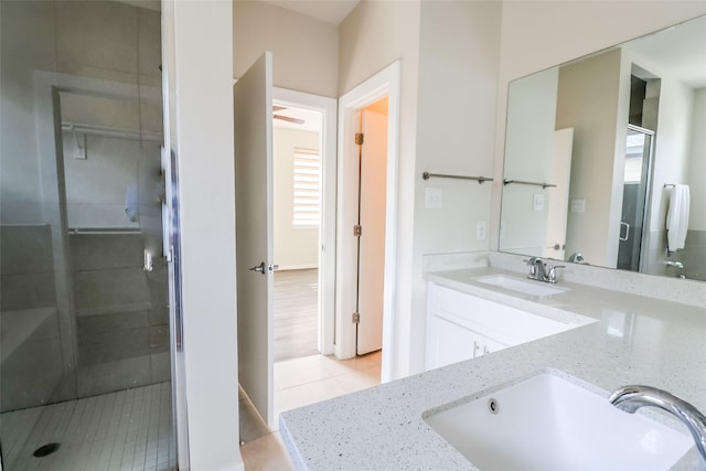 4508 Clover St, Houston, TX 77051 - bathroom featuring double vanity, a stall shower, tile patterned flooring, and plenty of natural light