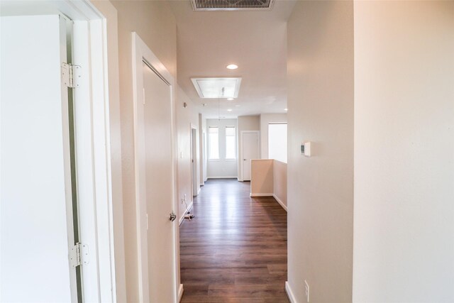 4508 Clover St, Houston, TX 77051 - hallway featuring dark wood-type flooring, baseboards, and attic access