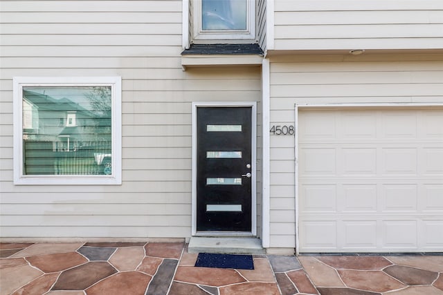 property entrance featuring a garage