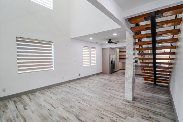 4508 Clover St, Houston, TX 77051 - unfurnished living room with light wood finished floors, baseboards, ceiling fan, and recessed lighting