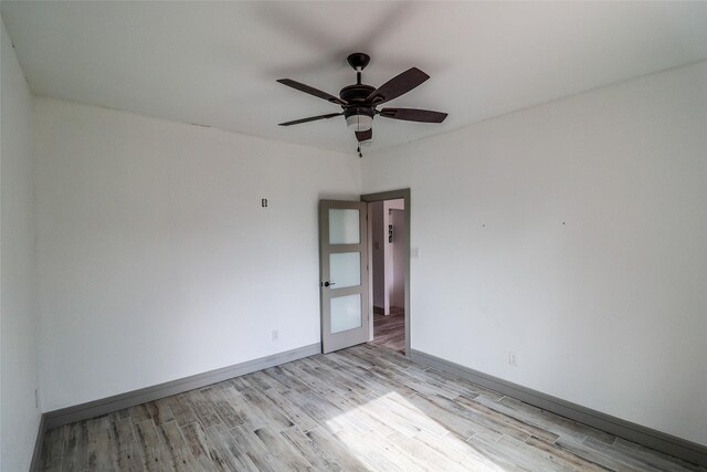 4508 Clover St, Houston, TX 77051 - empty room with light wood-style flooring, a ceiling fan, and baseboards