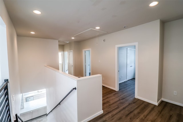 corridor with dark hardwood / wood-style floors