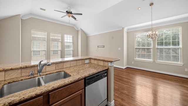 kitchen featuring pendant lighting, dishwasher, dark wood-type flooring, and vaulted ceiling