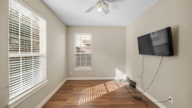 interior space featuring wood-type flooring and ceiling fan