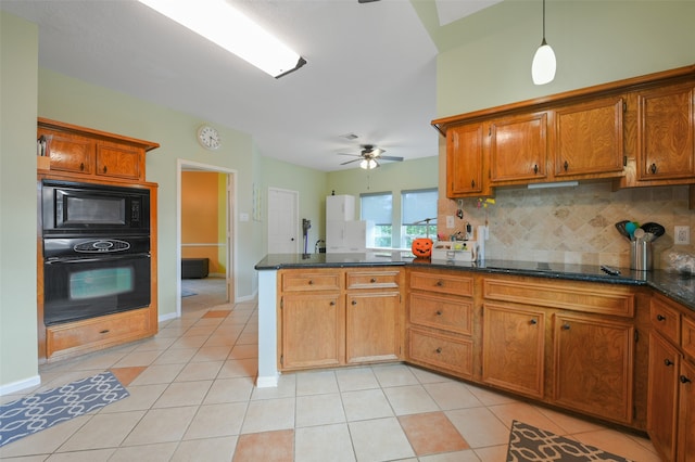 kitchen featuring backsplash, black appliances, dark stone countertops, light tile patterned flooring, and kitchen peninsula