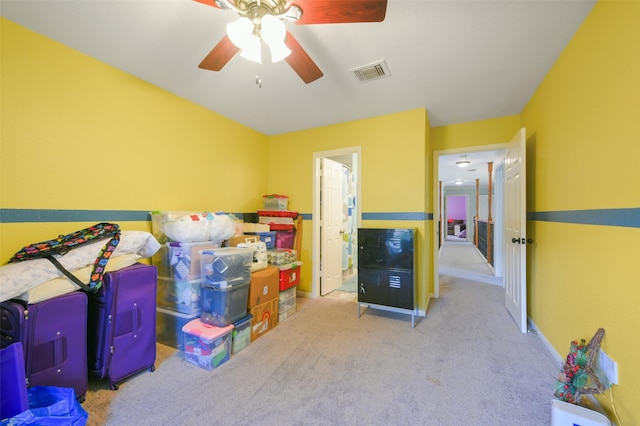 storage area featuring ceiling fan