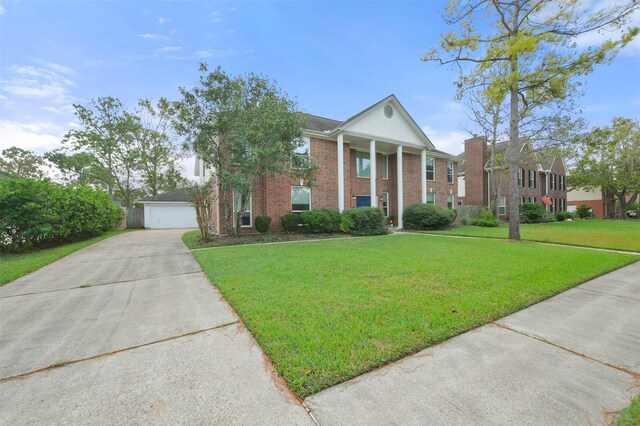 neoclassical home with a front lawn