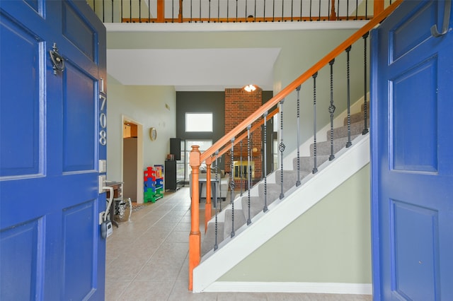 entryway with light tile patterned floors