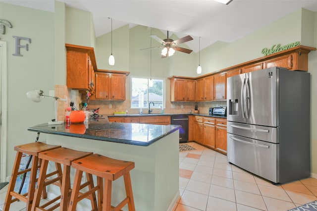 kitchen with dishwasher, sink, stainless steel refrigerator with ice dispenser, kitchen peninsula, and decorative backsplash