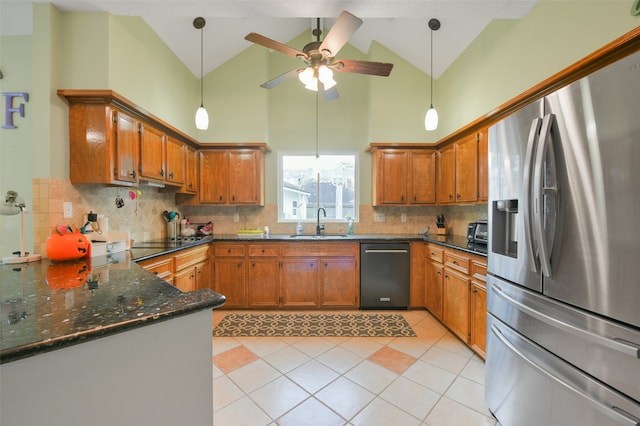 kitchen featuring tasteful backsplash, stainless steel appliances, ceiling fan, sink, and high vaulted ceiling