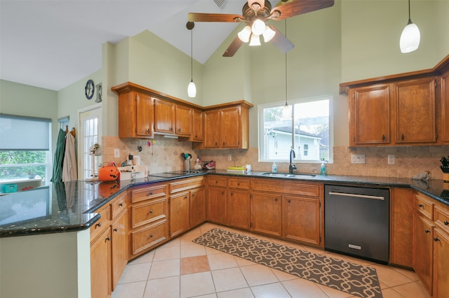 kitchen with dishwasher, sink, high vaulted ceiling, decorative light fixtures, and light tile patterned flooring