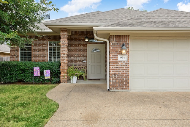 doorway to property with a garage