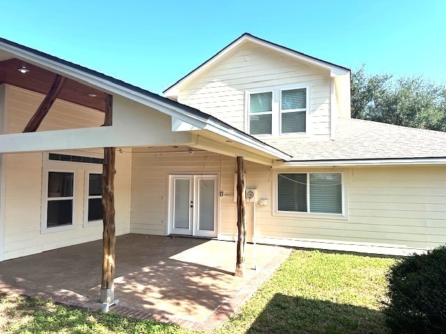 back of house with a patio area and french doors