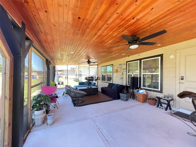 sunroom / solarium with wood ceiling and ceiling fan