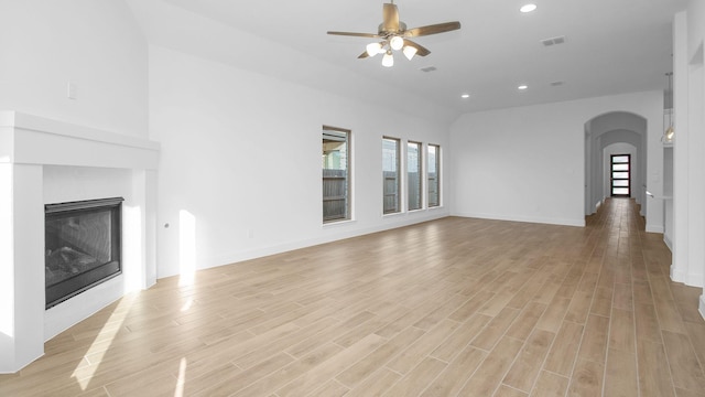 unfurnished living room featuring ceiling fan and light hardwood / wood-style floors