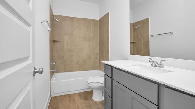 full bathroom featuring wood-type flooring, toilet, vanity, and  shower combination