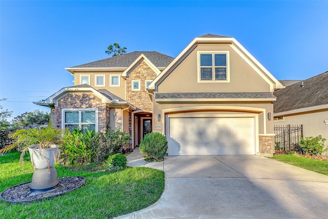 craftsman-style home with a garage and a front lawn