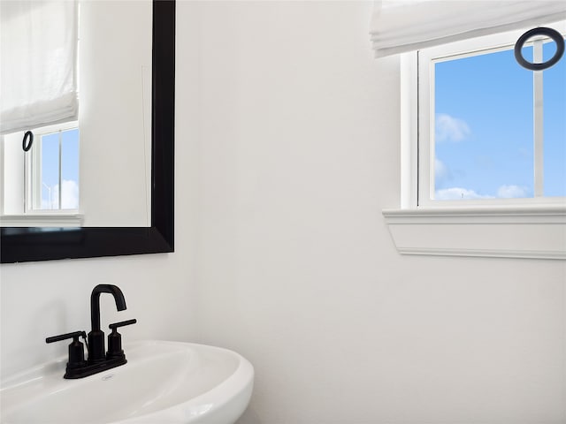 bathroom featuring a wealth of natural light and sink