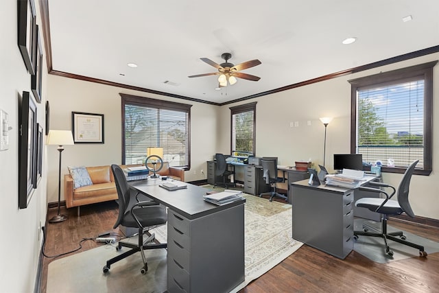 office area with dark wood-type flooring, ceiling fan, and crown molding