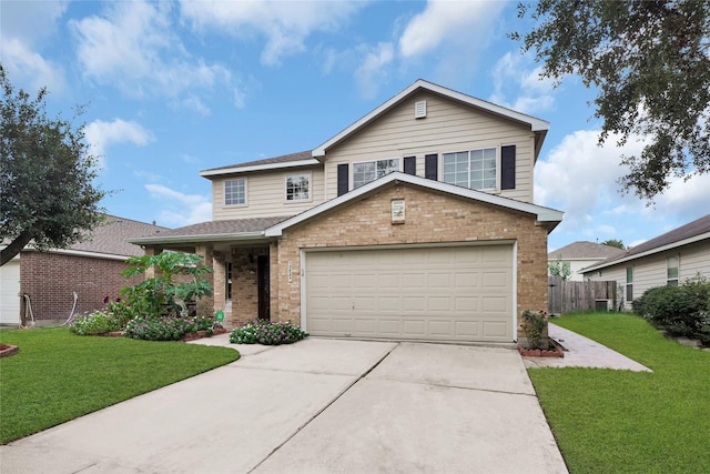 view of property with a front yard and a garage